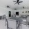 Clubhouse outdoor lounge with seating and cooling ceiling fans