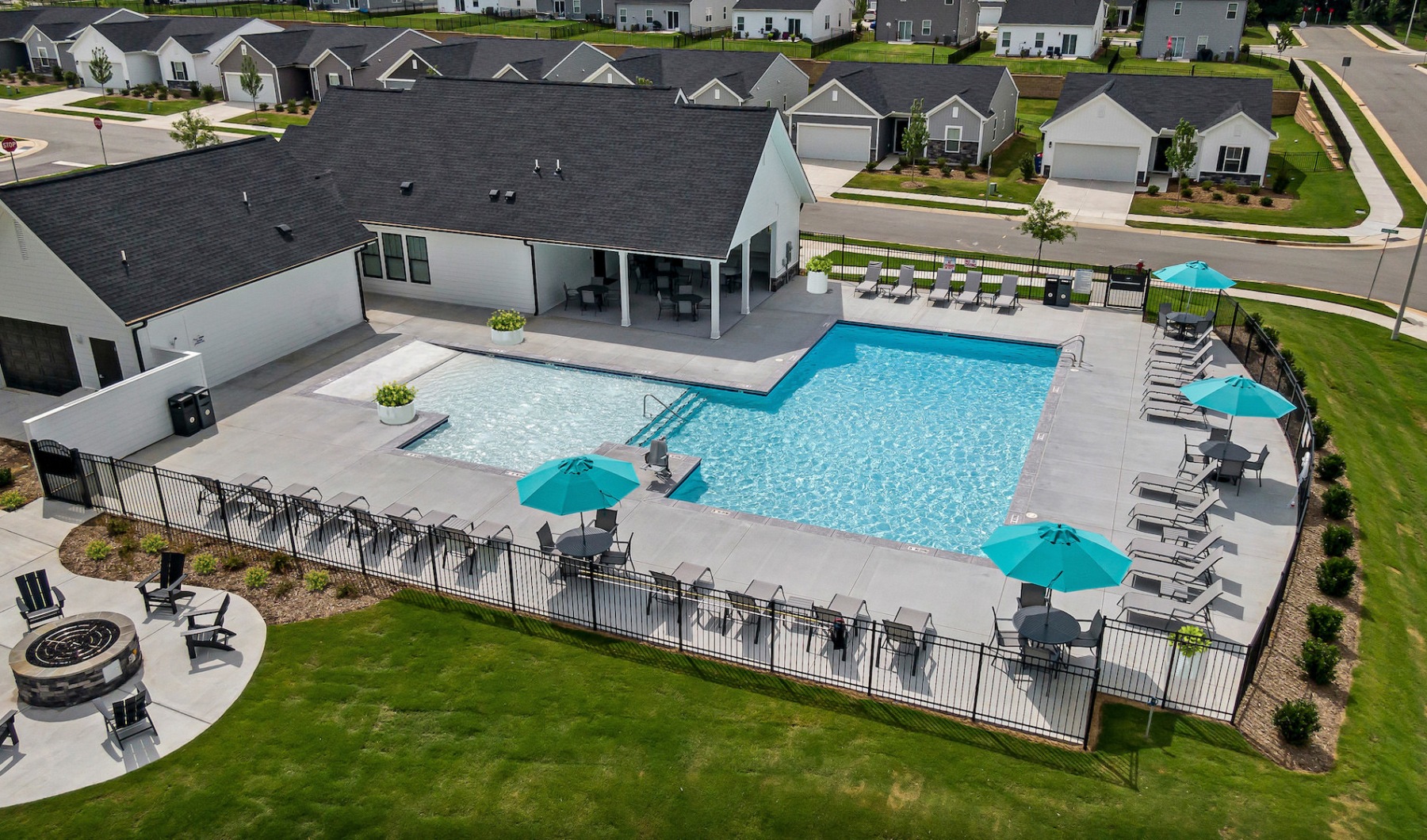 Image of neighborhood clubhouse with pool and fire pit